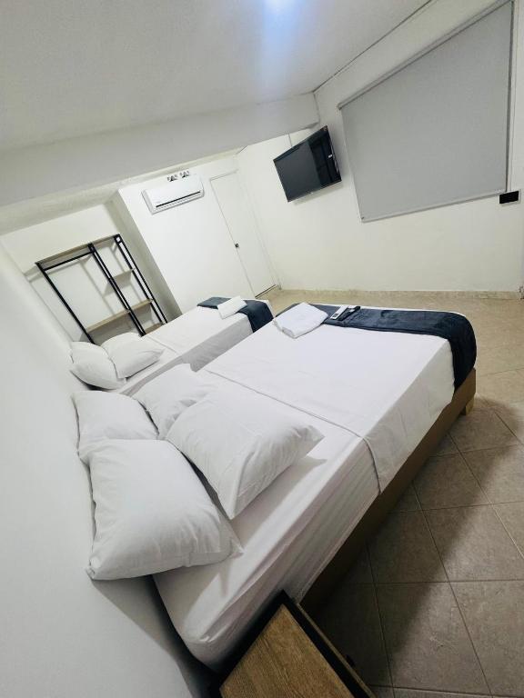 Postel nebo postele na pokoji v ubytování Hotel Estadio 80