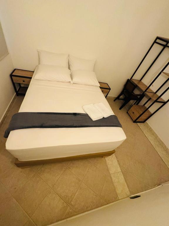 Postel nebo postele na pokoji v ubytování Hotel Estadio 80