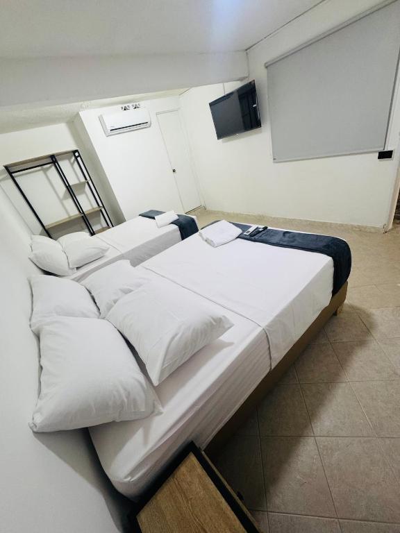 Postel nebo postele na pokoji v ubytování Hotel Estadio 80