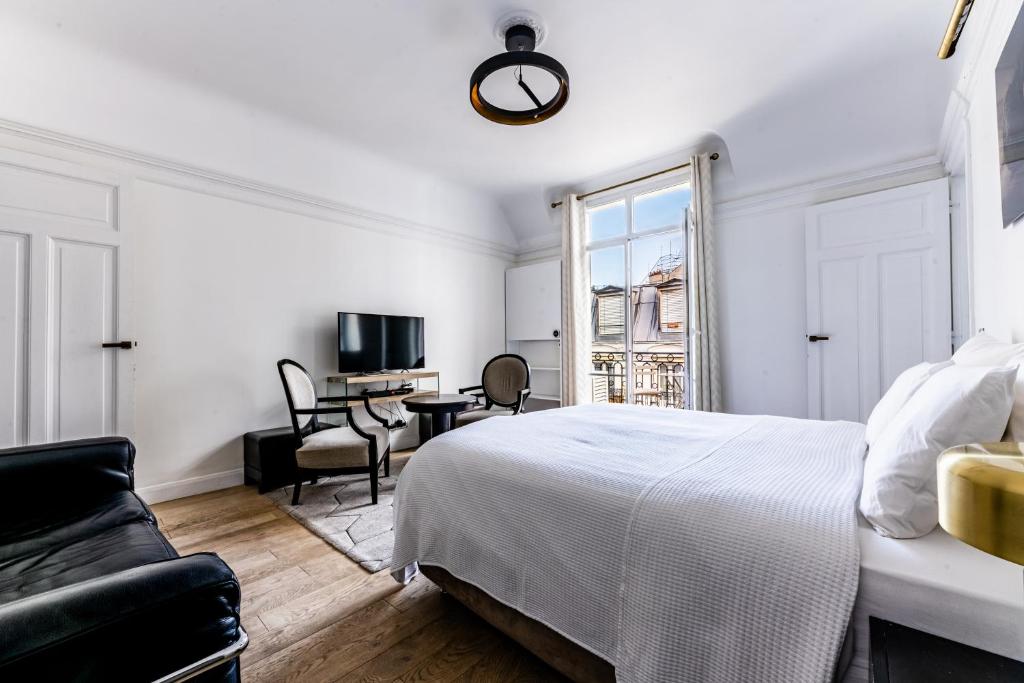 Telewizja i/lub zestaw kina domowego w obiekcie Appartement Champs Elysées