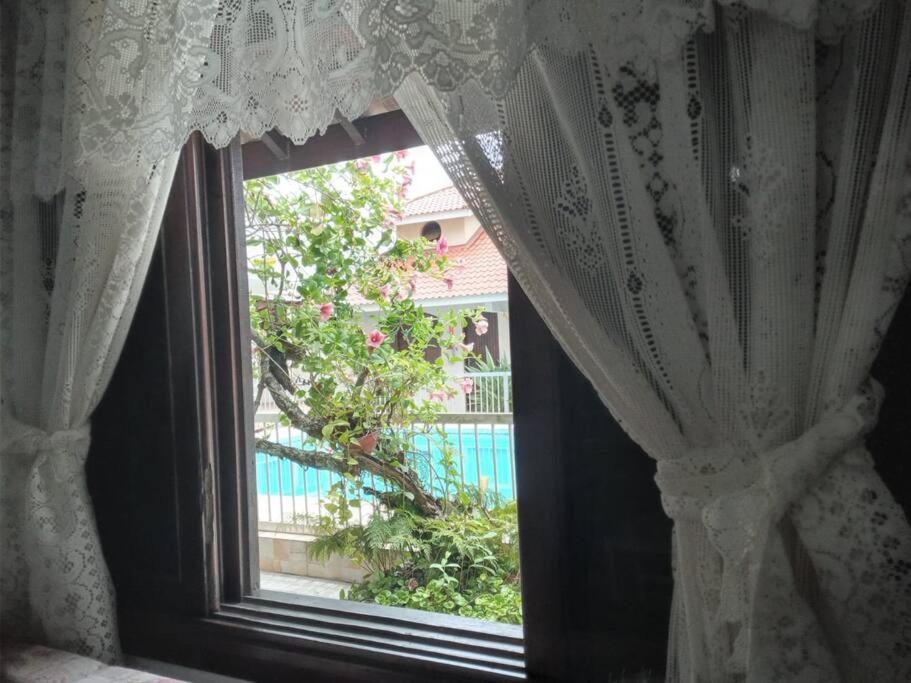 Πισίνα στο ή κοντά στο Apartamento com piscina condomínio Tapitema