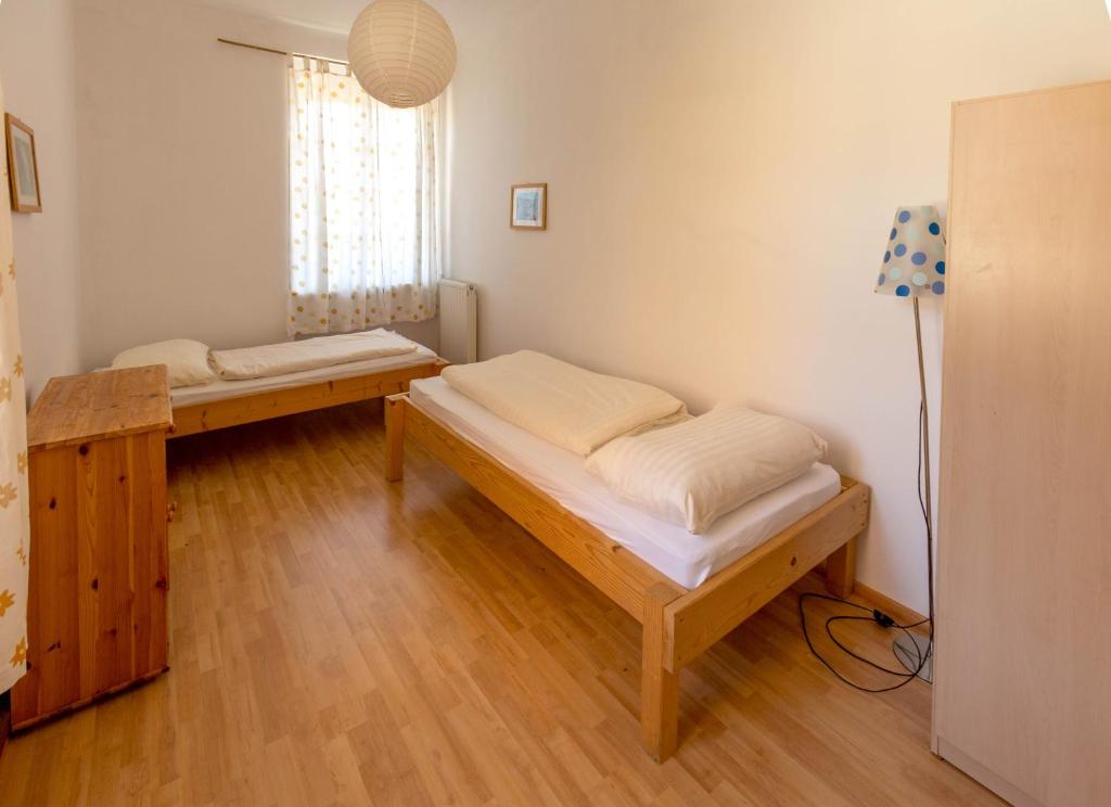 Postel nebo postele na pokoji v ubytování Fit und Fun Sportherberge