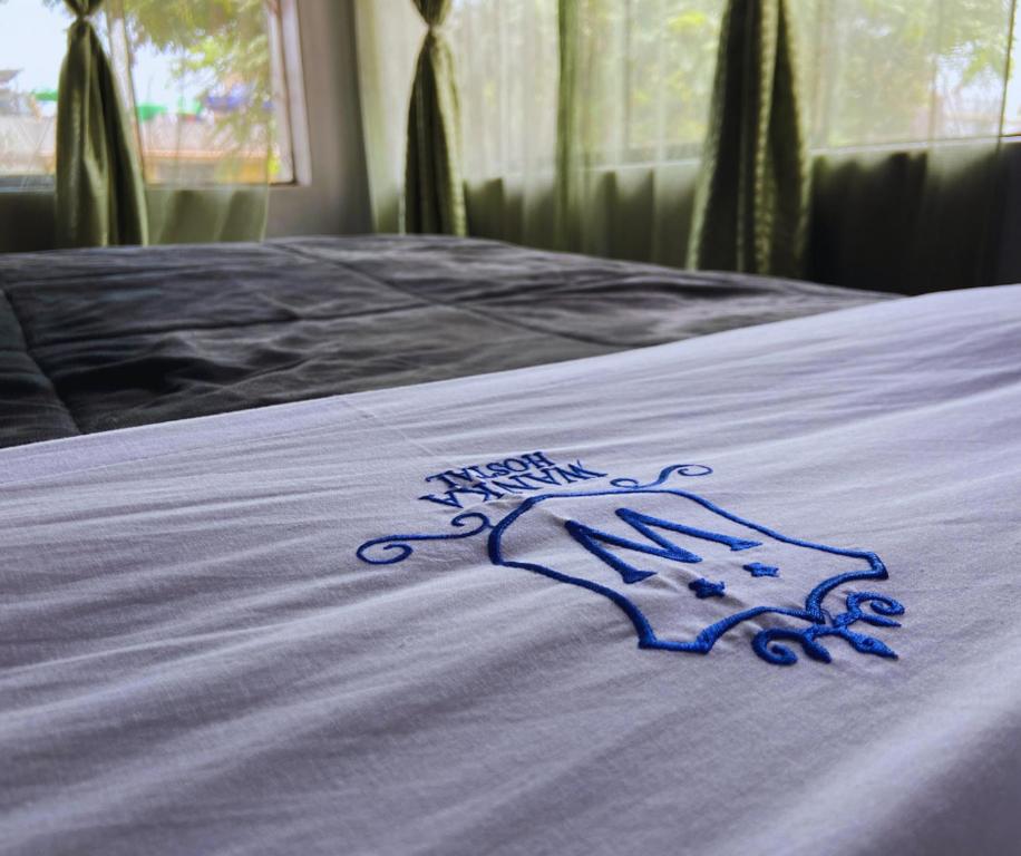 Postel nebo postele na pokoji v ubytování Hostal Wan Ka Trujillo