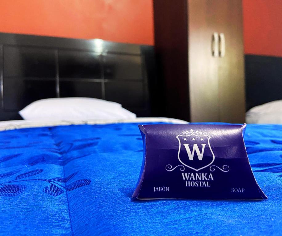 Postel nebo postele na pokoji v ubytování Hostal Wan Ka Trujillo