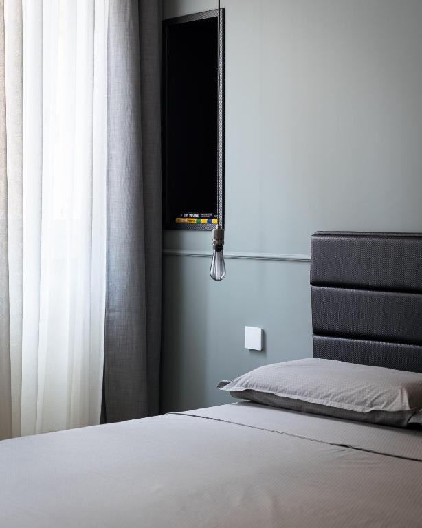 Łóżko lub łóżka w pokoju w obiekcie Casa Duomo Luxury Suites