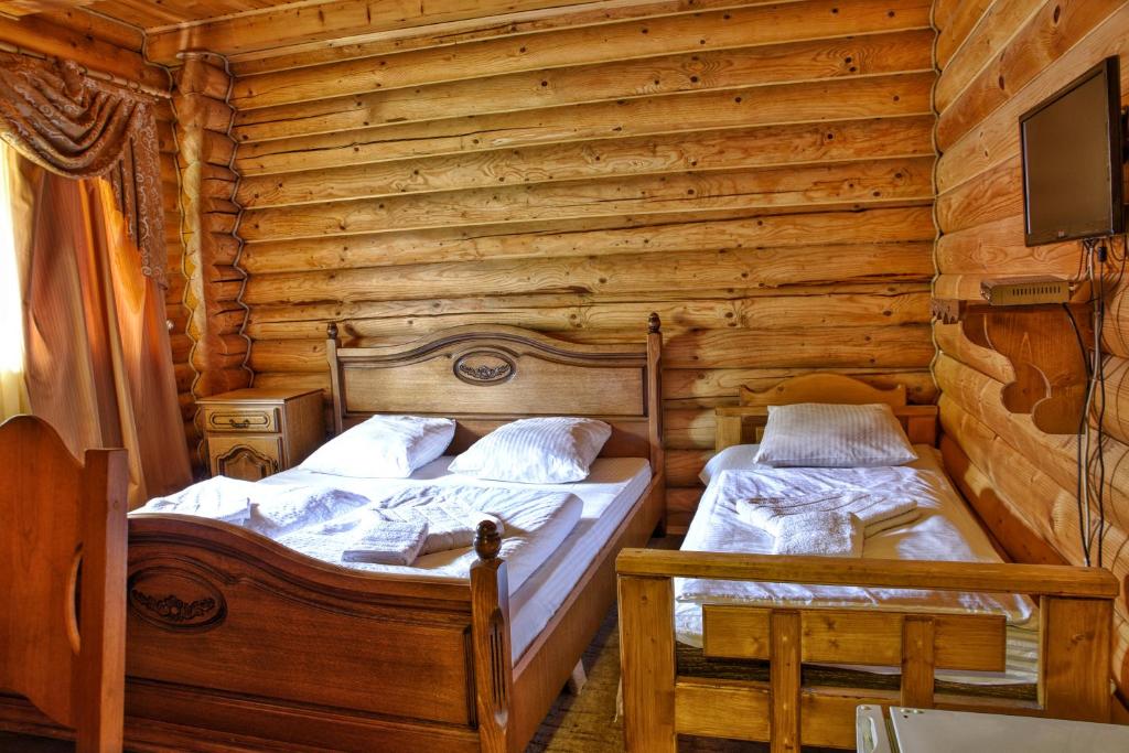 Postel nebo postele na pokoji v ubytování Gotel Milenium