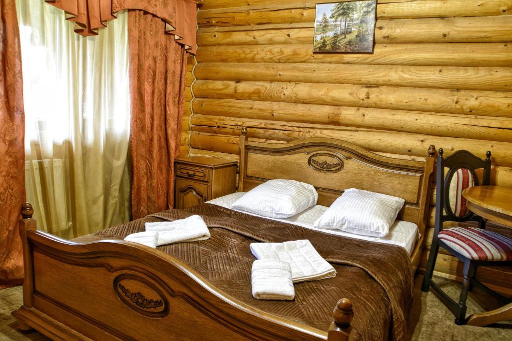 Postel nebo postele na pokoji v ubytování Gotel Milenium