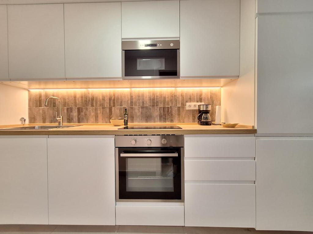 A kitchen or kitchenette at Playa Denia
