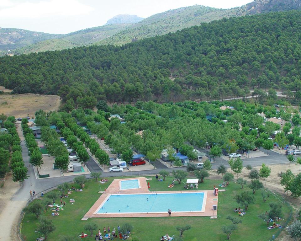 an aerial view of a park with a swimming pool at Camping Bungalows Mariola in Bocairent