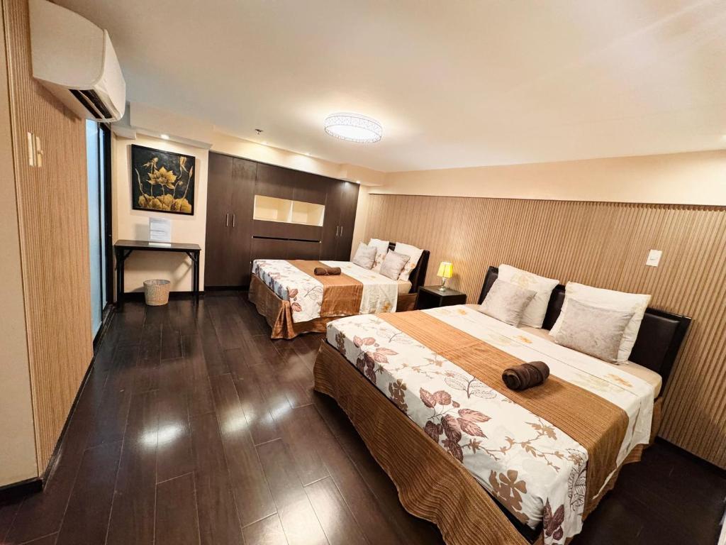 Postel nebo postele na pokoji v ubytování Super Cebu Loft