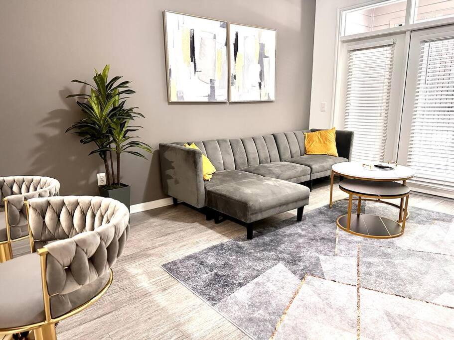 a living room with a couch and a table at Brand new 1 bed apt in the heart of Midtown in Houston