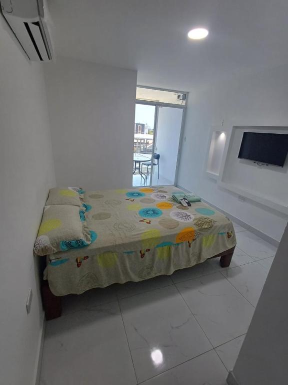 Postel nebo postele na pokoji v ubytování Hostal Las Orquideas 2