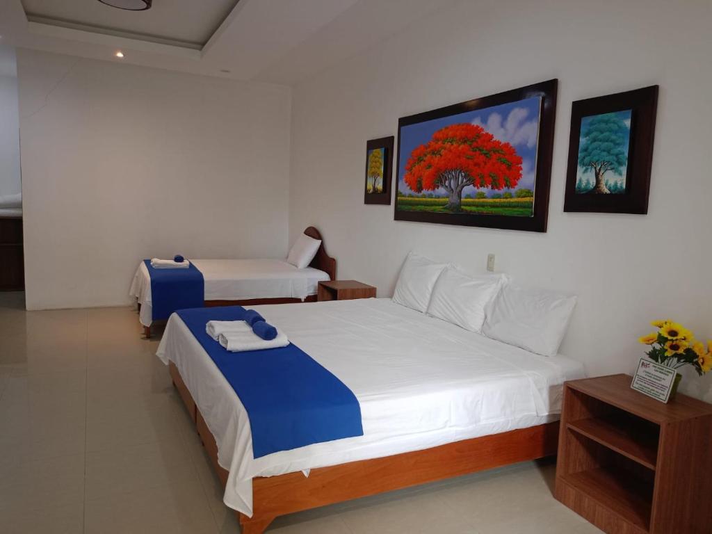 Postel nebo postele na pokoji v ubytování Galápagos Isabela Hotel Loja