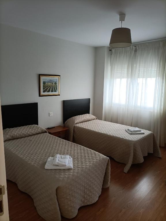 Postel nebo postele na pokoji v ubytování HOSTAL ALTO PÁRAMO