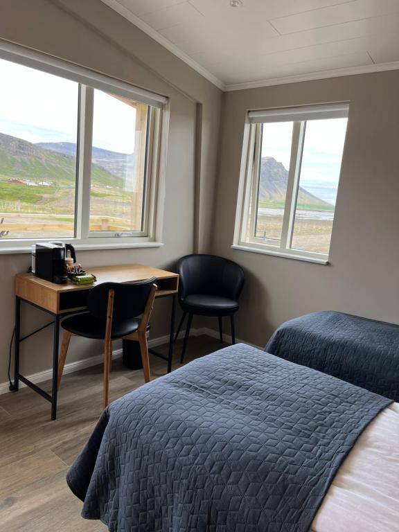 Ένα ή περισσότερα κρεβάτια σε δωμάτιο στο Strönd Guesthouse