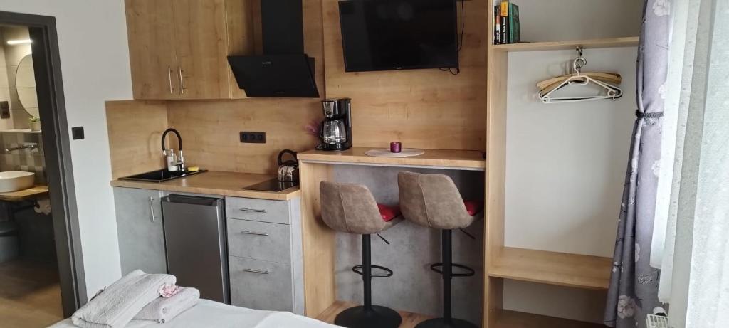 Kuchyň nebo kuchyňský kout v ubytování Chata POD HOUBOVÝM VRCHEM 2