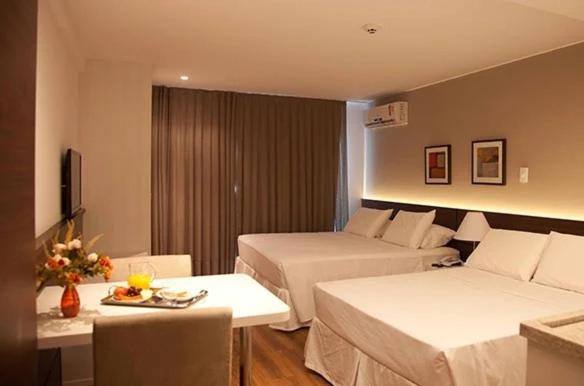 Postel nebo postele na pokoji v ubytování Atmosfera Hotel