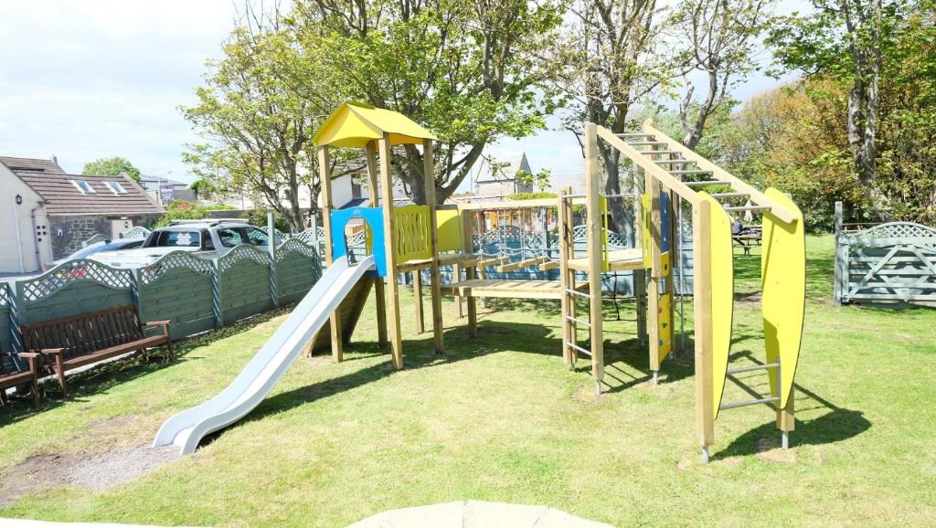 a playground with a slide and a slideintend at The Old Rectory - Brean in Brean