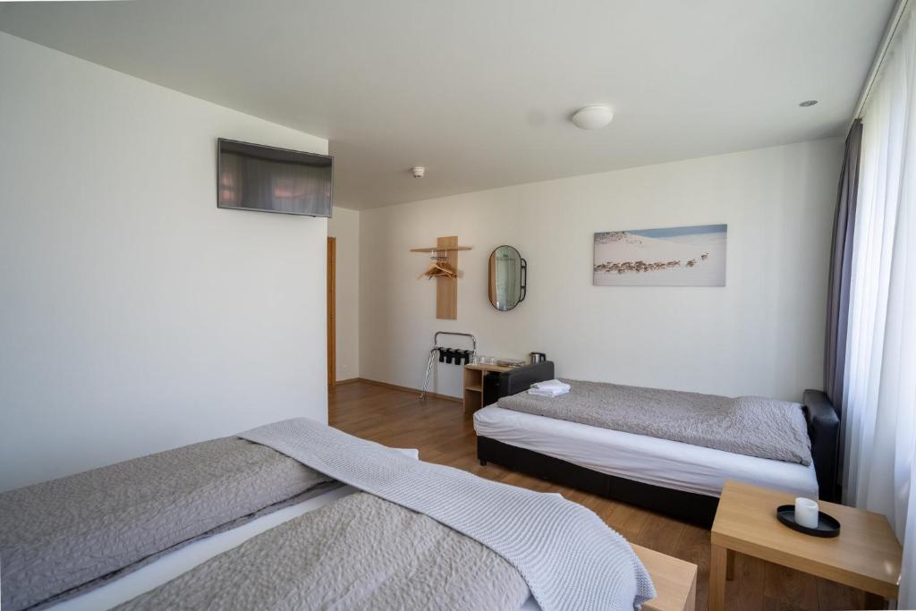 Postel nebo postele na pokoji v ubytování Hotel Eskifjörður