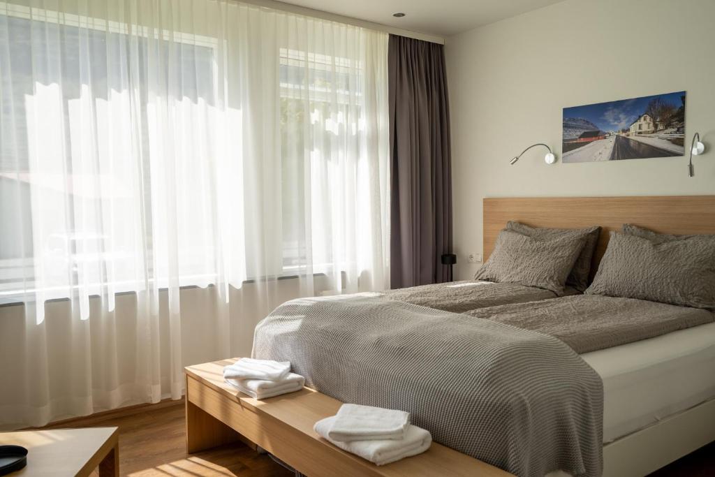 Postel nebo postele na pokoji v ubytování Hotel Eskifjörður