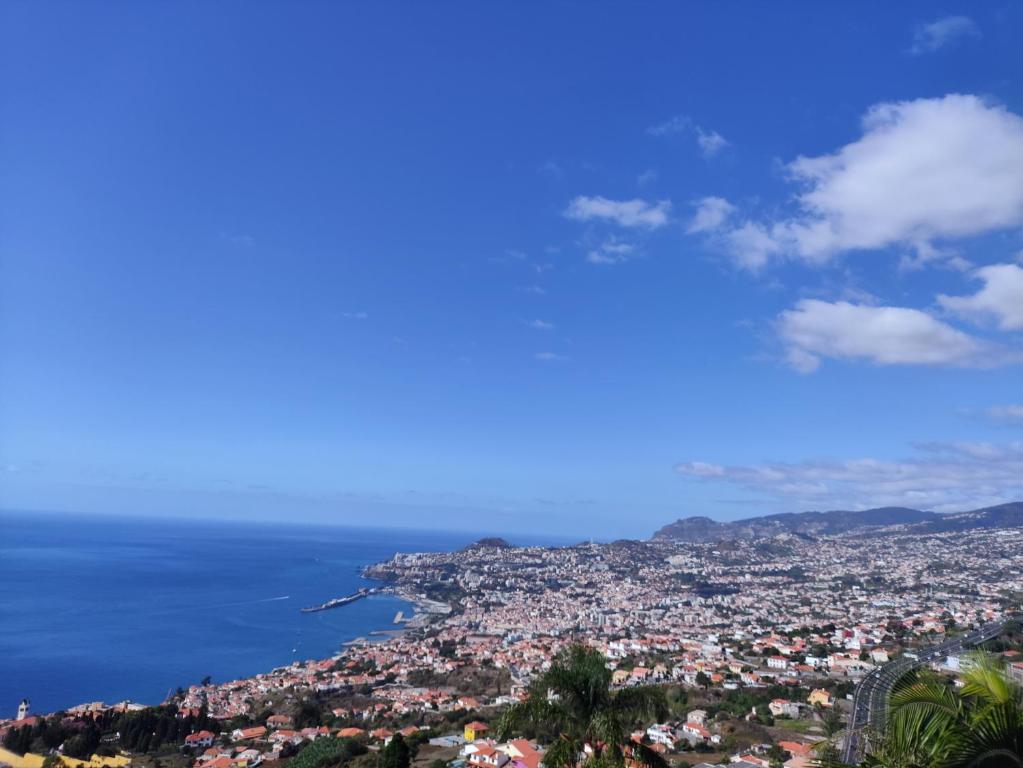 a view of a city and the ocean at Villa São João in São Gonçalo