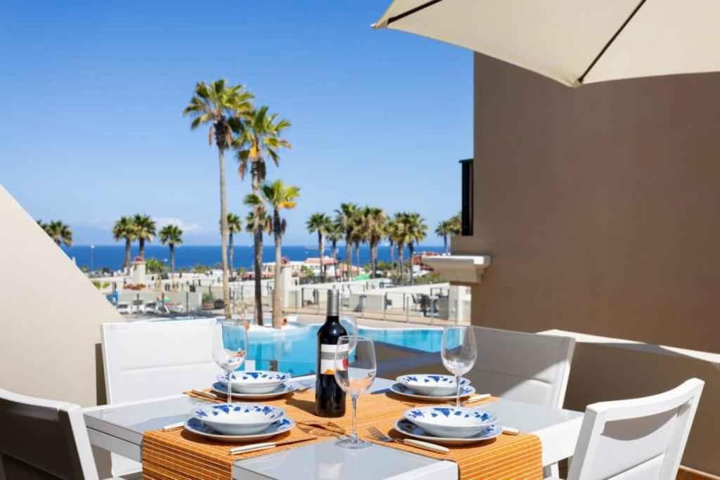 a dining room with a table with wine glasses at Apartment in Palm Mar - Insel Teneriffa 53099 in Palm-mar