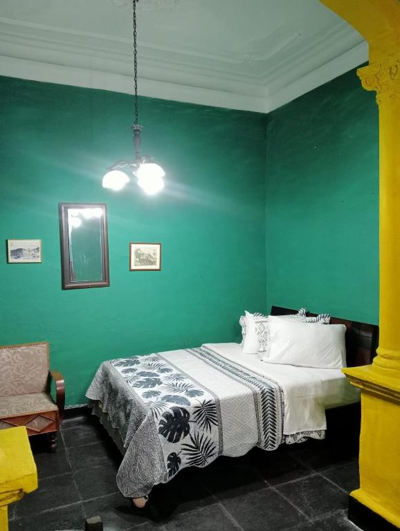 Postel nebo postele na pokoji v ubytování Hostal Hanoi en Bogotá