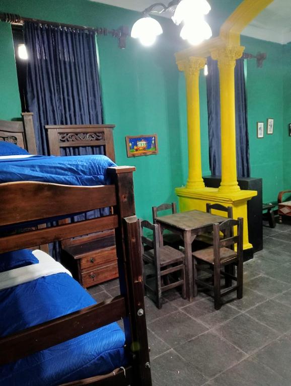 Postel nebo postele na pokoji v ubytování Hostal Hanoi en Bogotá