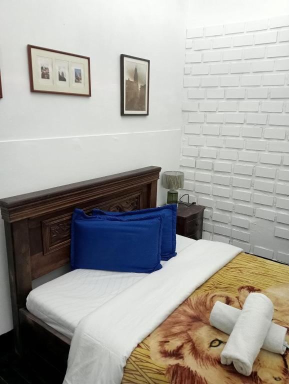 Postel nebo postele na pokoji v ubytování Hostal Hanoi en Bogotá