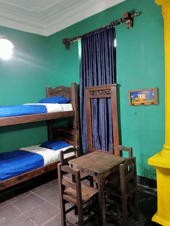 Postel nebo postele na pokoji v ubytování Hostal Hanoi en Bogotá