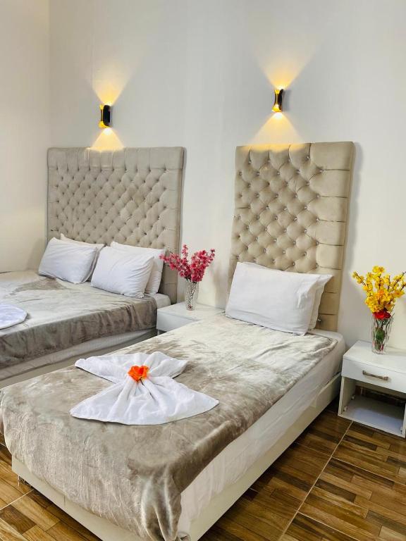 Postel nebo postele na pokoji v ubytování New Palace