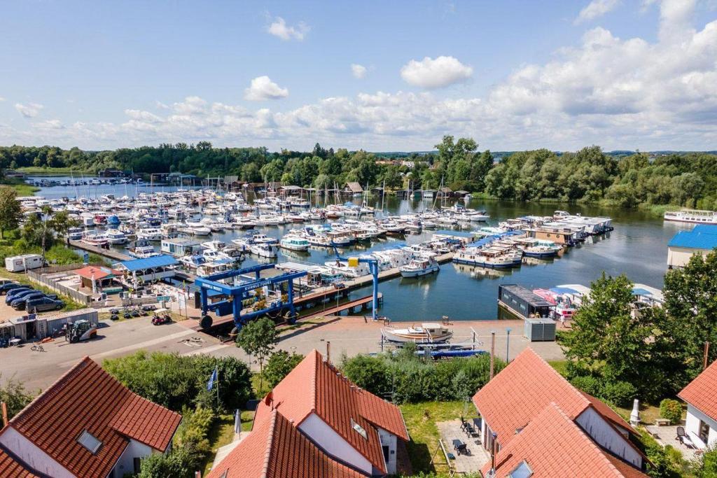 an aerial view of a marina with boats in the water at Fischerhaus-307-am-Yachthafen-Rechlin-Nord in Rechlin