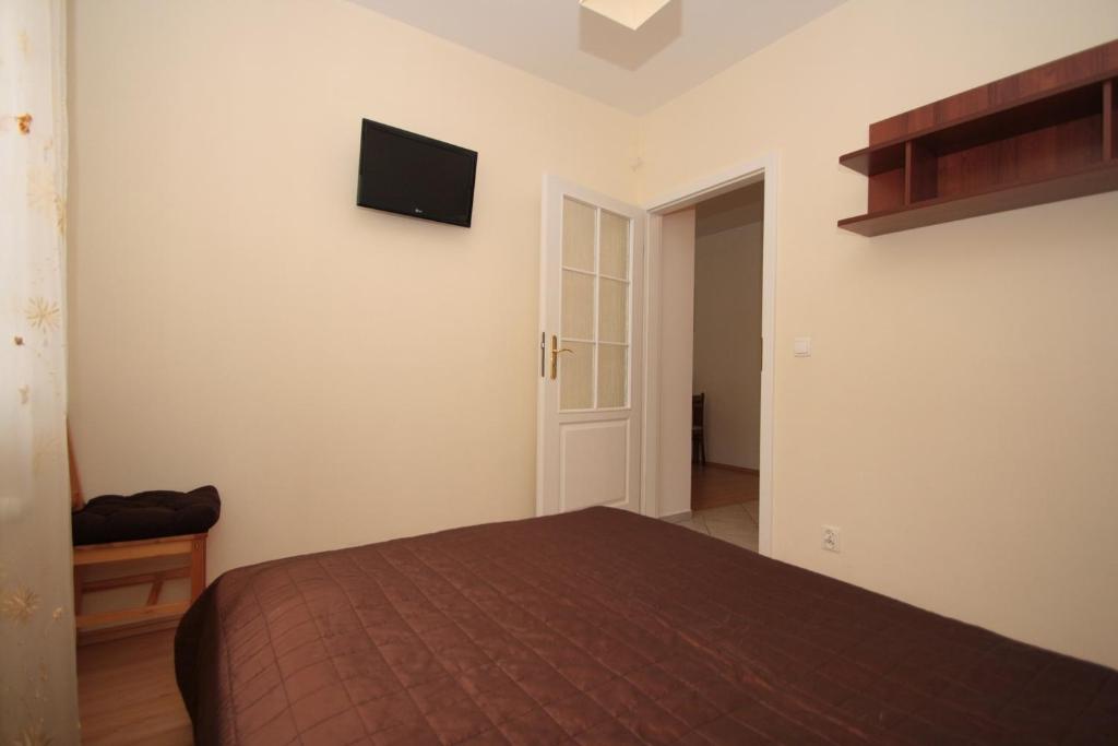 Posteľ alebo postele v izbe v ubytovaní 100-SIO Apartamenty
