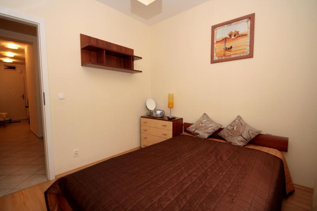Posteľ alebo postele v izbe v ubytovaní 100-SIO Apartamenty