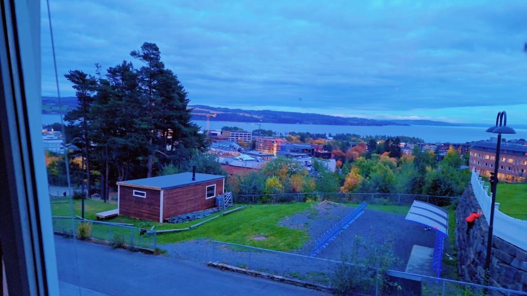 a view of a city from a window at Room In Handsome Haven House in Gjøvik