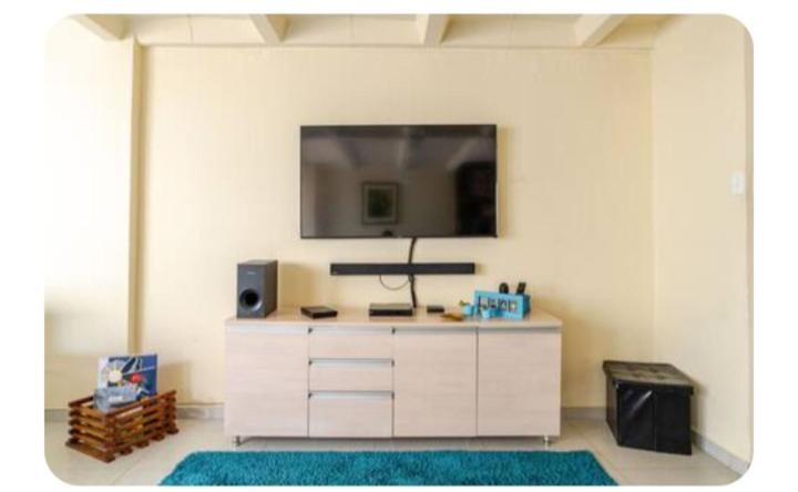 TV a/nebo společenská místnost v ubytování Casa Hermosa
