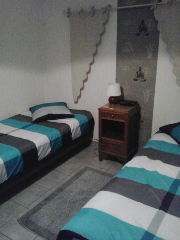 Postel nebo postele na pokoji v ubytování Villa Jules Verne - Chambres d'hôtes et gîte