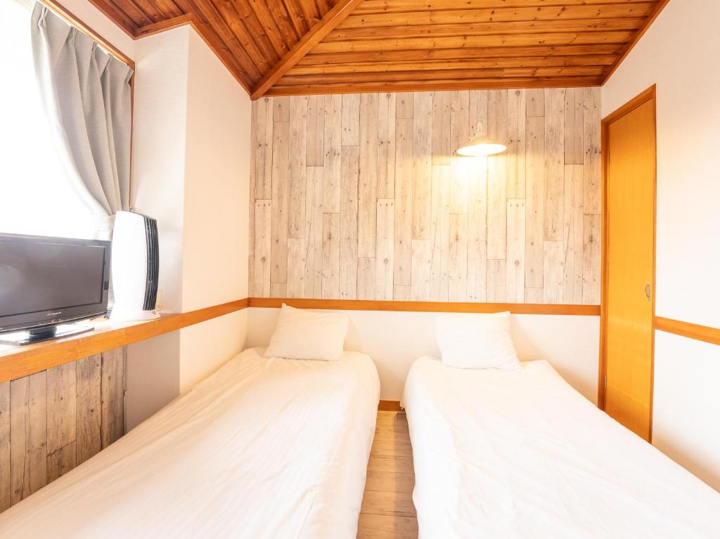 Postel nebo postele na pokoji v ubytování Tabist Pension Third Place
