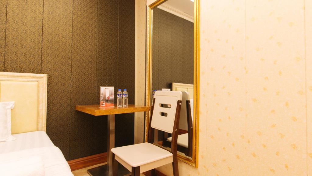 Postel nebo postele na pokoji v ubytování RedDoorz Plus at Winter Benitez