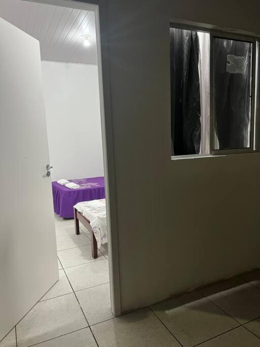 Postel nebo postele na pokoji v ubytování Suíte independente Atílio