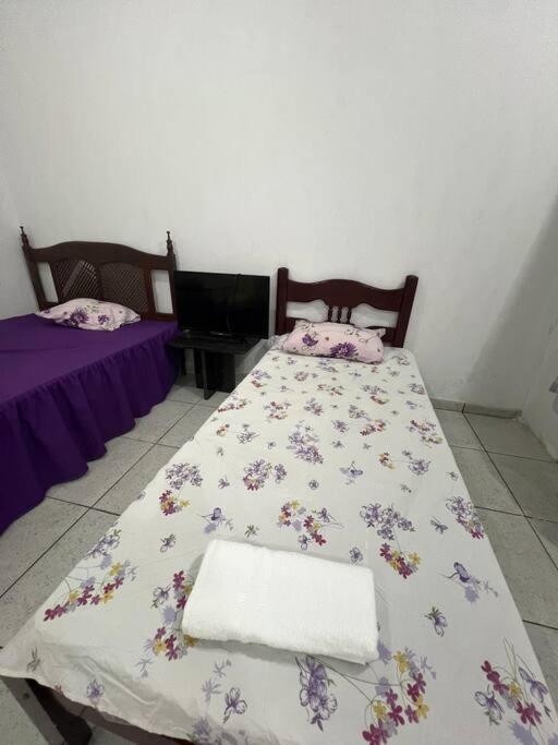 Postel nebo postele na pokoji v ubytování Suíte independente Atílio