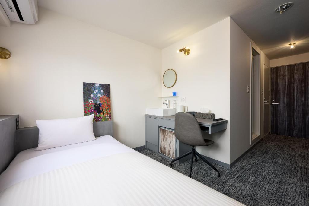 Postel nebo postele na pokoji v ubytování Hotel WWJ