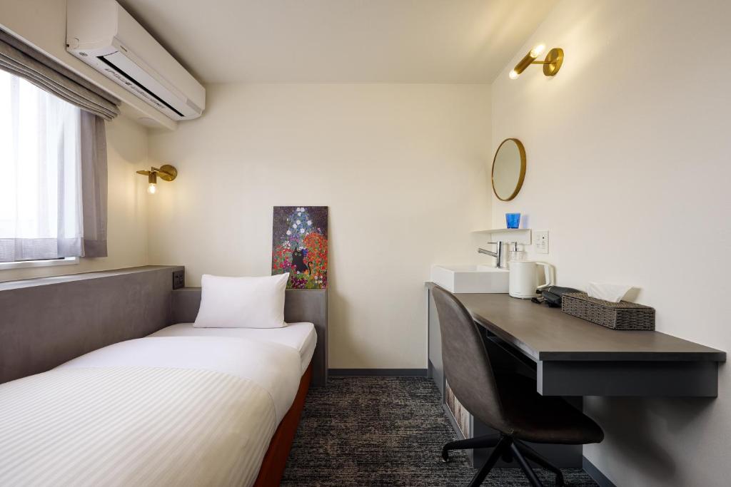 Postel nebo postele na pokoji v ubytování Hotel WWJ
