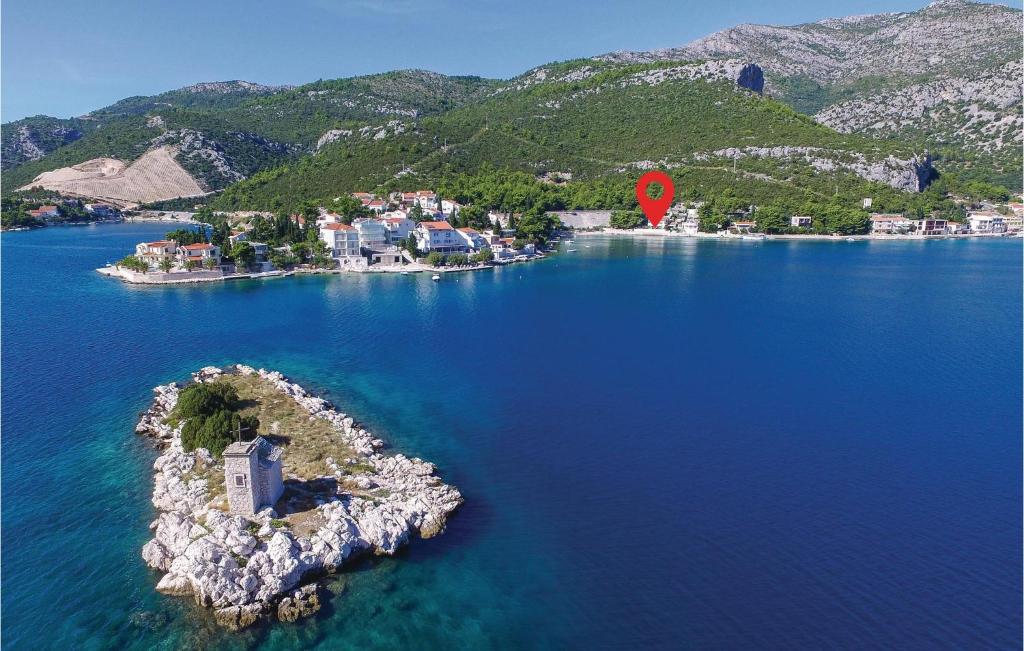 an island in the middle of a large body of water at Stunning Home In Klek With Sauna in Klek