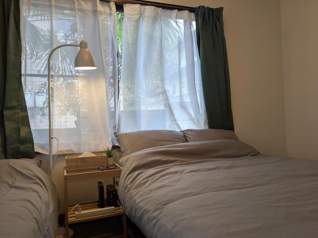Postel nebo postele na pokoji v ubytování Private Lodge 春夏秋冬 -SHIKI-