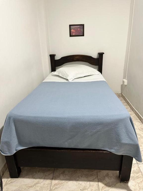 Postel nebo postele na pokoji v ubytování Hotel Plaza Real Pereira