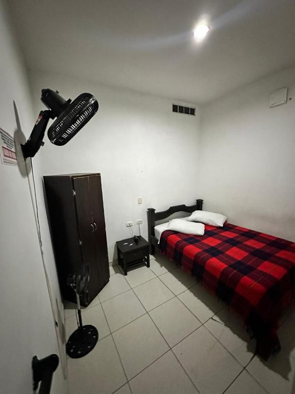 Postel nebo postele na pokoji v ubytování Hotel Plaza Real Pereira