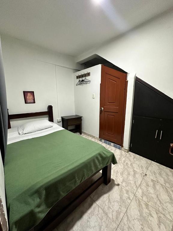Postel nebo postele na pokoji v ubytování Hotel Plaza Real Pereira