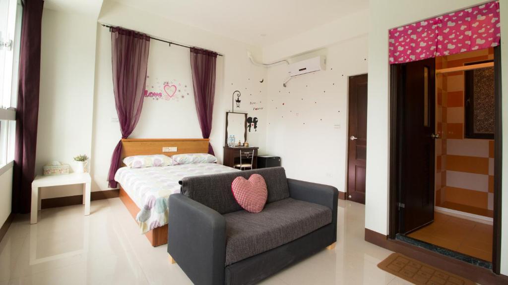 Postel nebo postele na pokoji v ubytování Fu Taitung Homestay