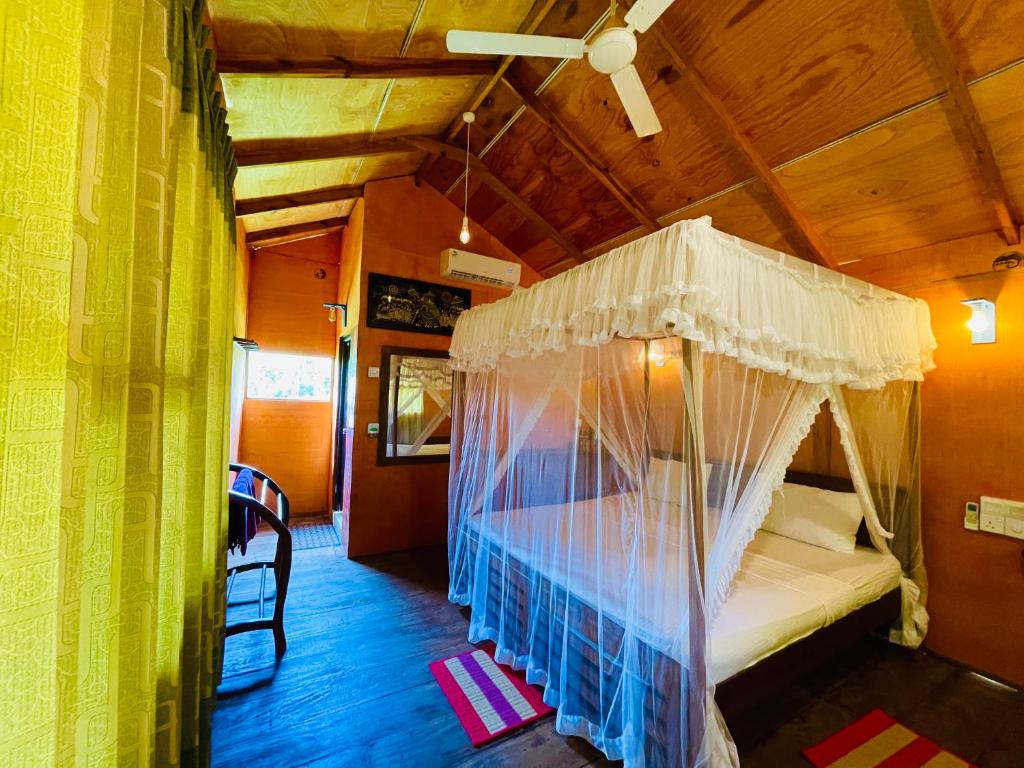 Postel nebo postele na pokoji v ubytování Sungreen Cottage Sigiriya